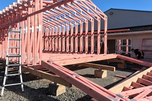 First portal trusses standing on the raised timber floor